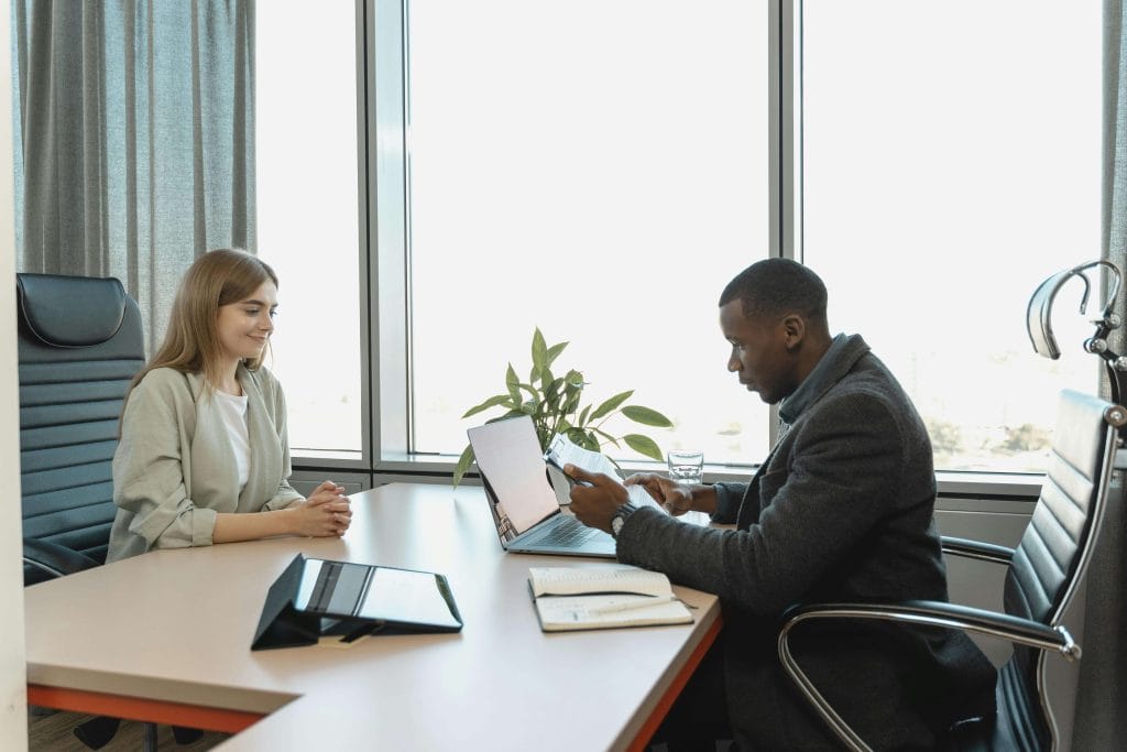 A professional conversation takes place in an office, representing the importance of ADHD neuropsychological testing in providing clarity and guiding support strategies.